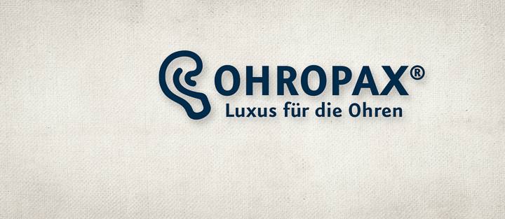 Leinenhintergrund mit blauem Ohropax Logo.